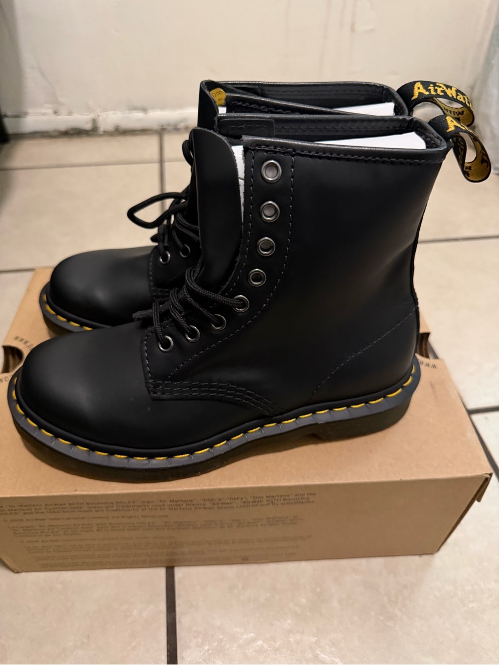 Dr. Martens Black Leather 8-Eye Lace-Up Boots with Yellow Stitching
